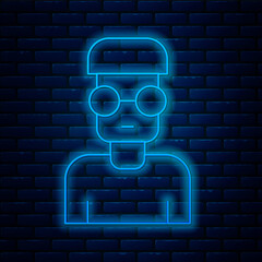 Glowing neon line Nerd geek icon isolated on brick wall background. Vector - obrazy, fototapety, plakaty