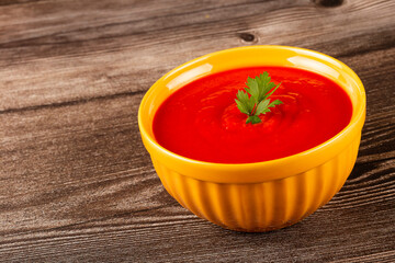 Delicious homemade tomato soup in bowl.