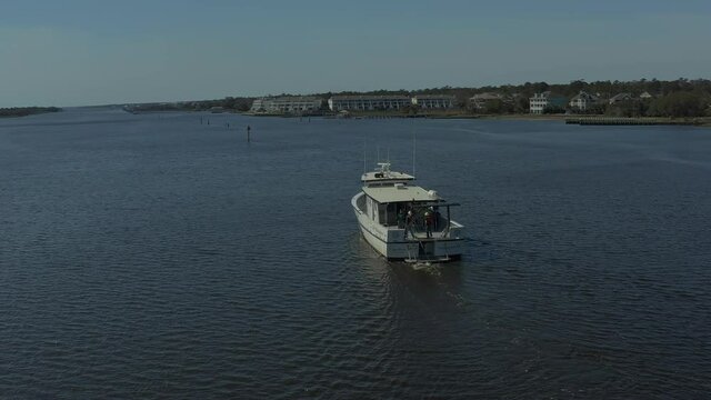 Epic shot of boat in water of the Wilmington or Wrightsville Beach inlet.