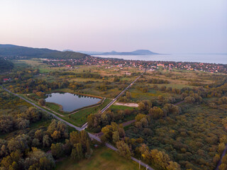 Aerial view of the hilltop chapel (St. Michael's Chapel) near Lake Balaton, at Vonyarcvashegy, background Badacsony hill at sunset