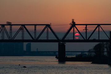 Fototapeta premium View of the Ob river at sunset. Beautiful sunset on the background of the river. 