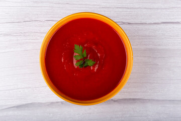 Delicious homemade tomato soup in bowl.