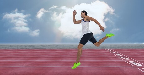 Composition of caucasian male runner over sports field