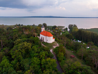 Aerial view of the hilltop chapel (St. Michael's Chapel) near Lake Balaton, at Vonyarcvashegy at sunset