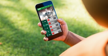 Composition of caucasian woman using smartphone with sports app over garden