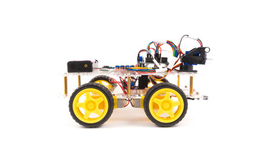 Programmable four wheels drive (4WD) robotic car with obstacle avoidance and line follow ability, isolated on white background with clipping path