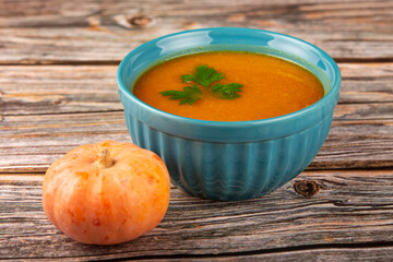 Delicious homemade pumpkin soup in bowl.