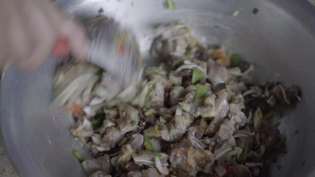 Close up: Hok Khana Kasathei, pig ear chutney, stirred from above