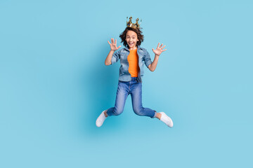 Full body photo of young boy prince happy positvie smile jump up have fun isolated over blue color background