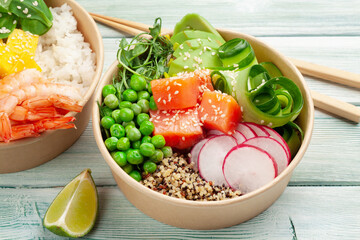 Poke bowls with shrimps, salmon, avocado and mango