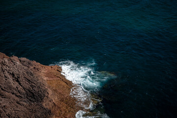 waves crashing on rocks