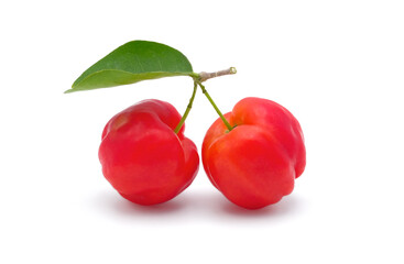 Fresh red acerola cherries with green leave isolated on white background.