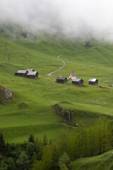 Misty and rainy day at Curaglia  in swiss mountain valley in direction  of  Lukmanier mountain pass.