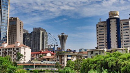 View of residential buildings, skyscrapers and a Ferris wheel. Skyline view. Changsha. Hunan. China. Asia