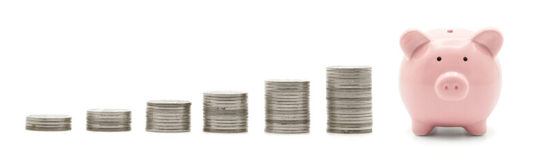 Silver coins stack and pink piggy bank isolated on white background with growth, Coins arranged as a graph. Concept of money saving and business finance.