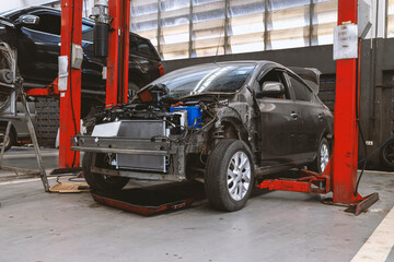 car in automobile repair service center with soft-focus and over light in the background