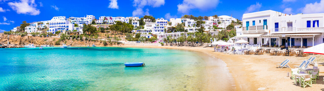 Greece holidays, Cyclades, Paros island beaches and sea. Scenic tranquil coastal village Piso Livadi with turquoise sea and taverns by the sea