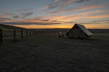 Sunrise on a tent at Grasslands National Park, Saskatchewan, Canada