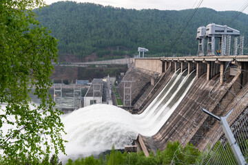 water drain wave, rapid water flows at the Krasnoyarsk dam hydroelectric power station in Russia....