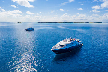 Fototapeta na wymiar Aerial view of tourist ships near an island in the Indian Ocean