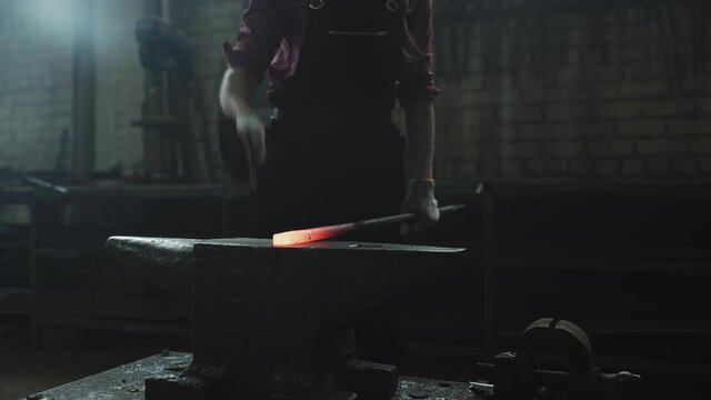 blacksmith girl working in her workshop