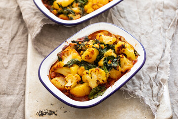 Saag aloo vegan pie with bean filling and potato and cauliflower topping