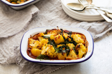 Saag aloo vegan pie with bean filling and potato and cauliflower topping