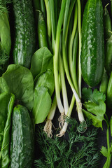 Close up Green vegetables, dark leafy food background.