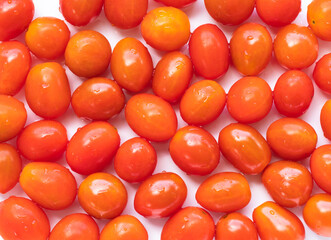 High angle view of full frame image of bright red tomatoes. Suitable for food background or artwork.