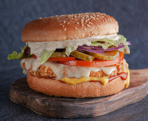 burger stuffed on a wooden stand