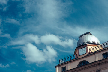 Old building on blue cloudy sky