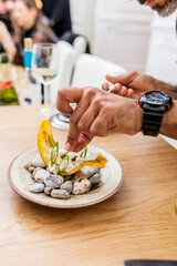 Close up of latin cook cooking caviar at home