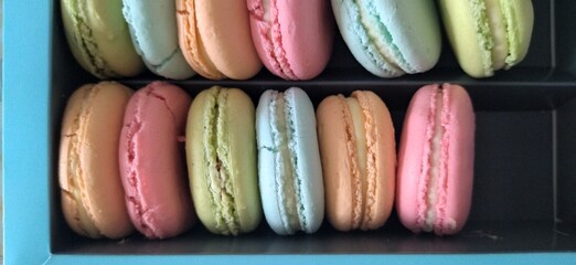 colorful macaroons on a wooden table