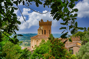 View on the bell tower of the Duomo and the church of S.S. Crucifix in San Miniato Tuscany Italy