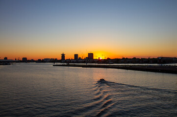Sunset by the water - construction work in amsterdam