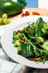 Vegan green vegetable salad with avocado and pecan