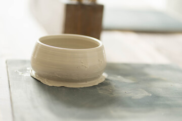clay bowl stotti on a stand