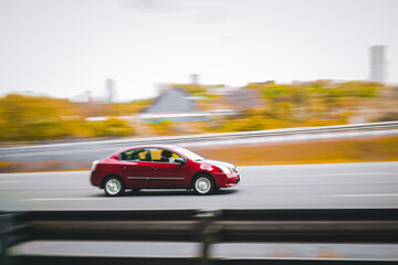Fototapeta na wymiar Red Car in motion