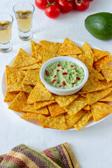 Guacamole with corn chips nachos. Mexican food. Vegetarian food.