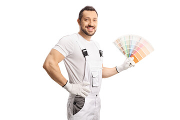 House decorator in a white uniform holding a color palette