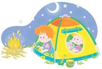 Obraz na płótnie Canvas Cheerful little kids tourists with a merry pup resting in their colorful camp tent on a starry night on summer vacation, vector cartoon illustration isolated on a white background