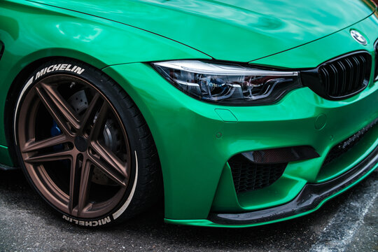 BMW M3 F80 Sport Car wrapped in green vinyl wrap equipped with AC Schnitzer wheels with low profile tires on Drift And Cars Show