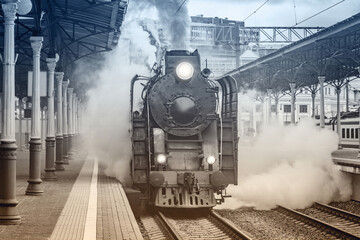 Retro train departs from the platform.