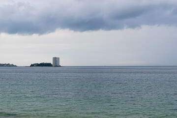 Obraz premium View of the island of Toralla during the day with a stormy sky. Vigo