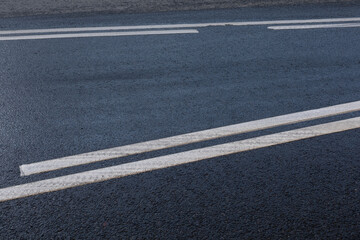 Road markings on the asphalt. Public transport stop zone and intermittent white line