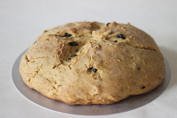 Home baked Irish soda bread with raisins. A quick bread to make at home with out yeast.