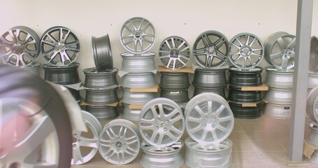 Sale of aluminum disks for the car. Discs are stacked in rows. Point of sale for spare car watches.