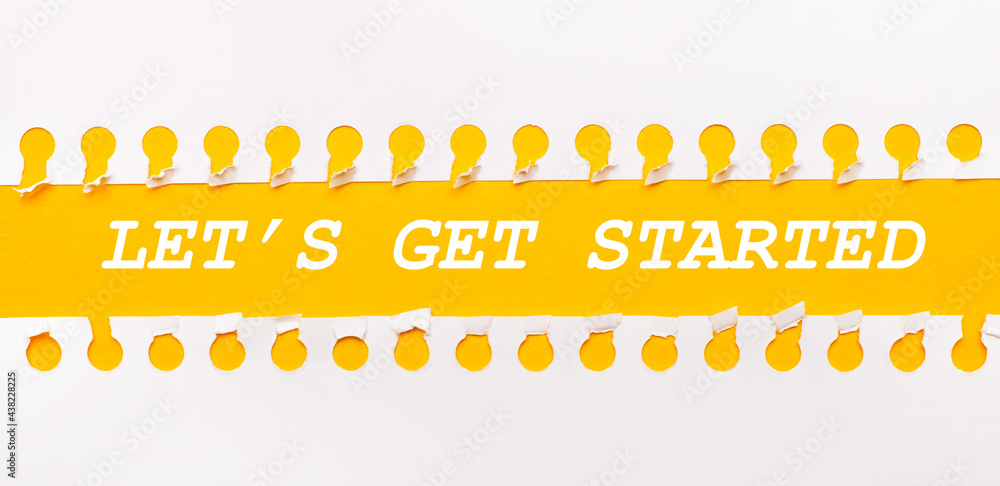 Aufkleber torn paper strip on yellow background with text let is get started