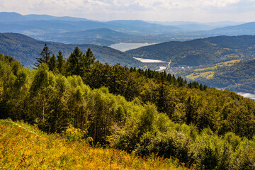 Panoramic view of Beskidy Mountains surrounding Zywieckie and Miedzybrodzkie Lake seen from Gora Zar mountain near Zywiec in Silesia region of Poland