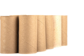 Rows of cardboard rolls from toilet paper isolated on white background.
